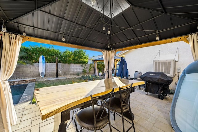 view of patio / terrace with area for grilling and a gazebo