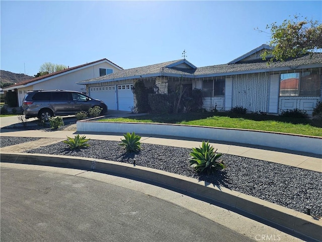 single story home featuring a garage