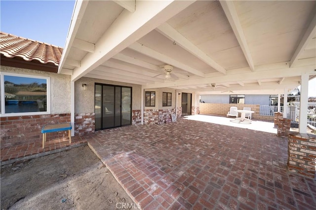 view of patio / terrace featuring ceiling fan