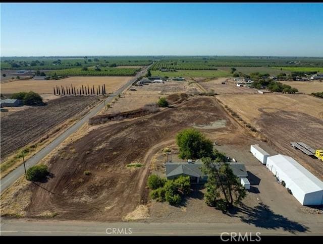 birds eye view of property with a rural view