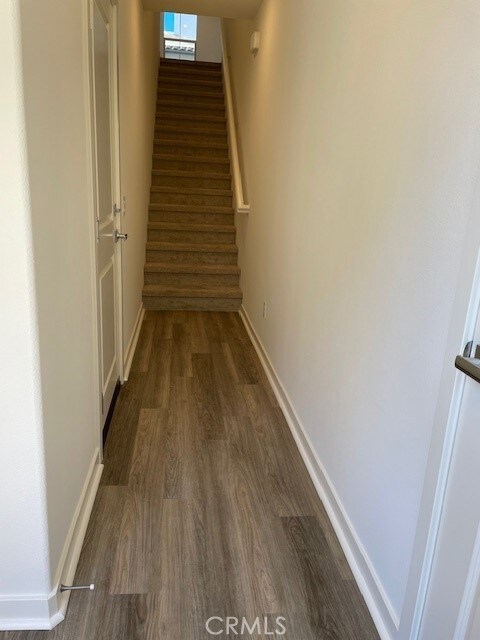 hallway featuring dark hardwood / wood-style floors