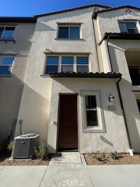 doorway to property with central air condition unit