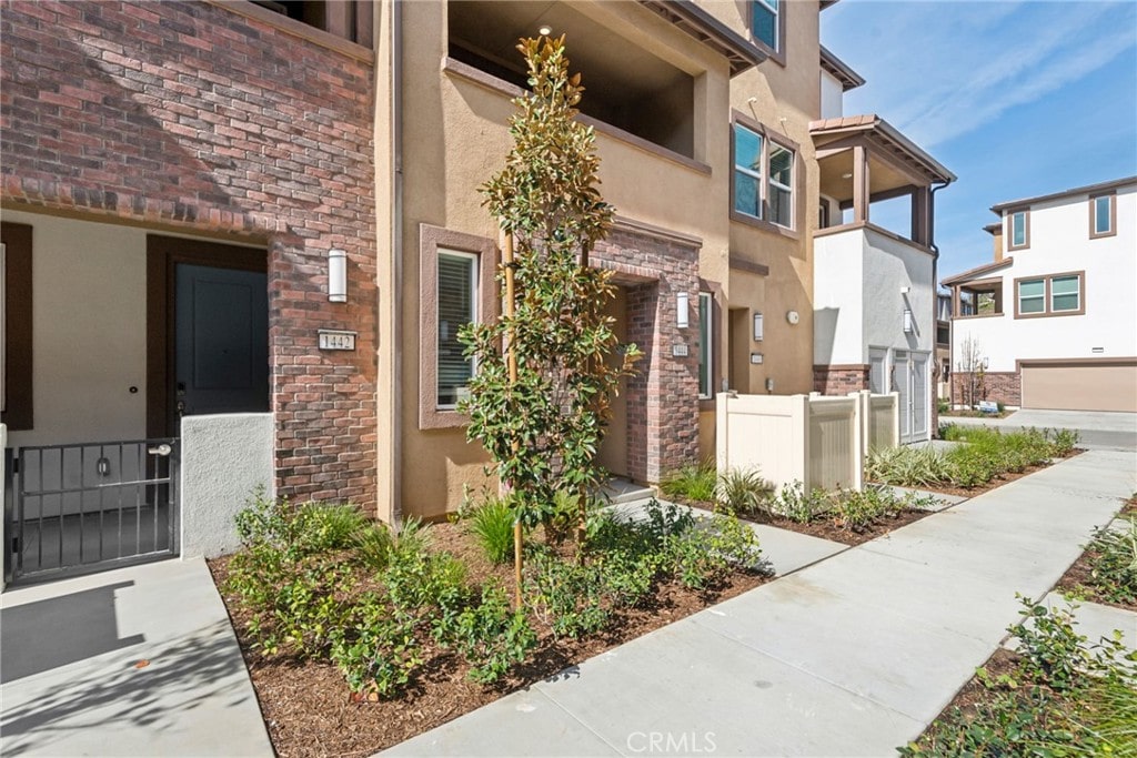 property entrance with stucco siding