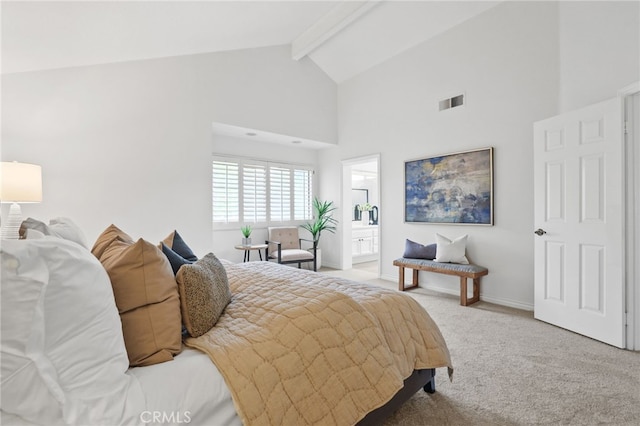 carpeted bedroom with beam ceiling, visible vents, ensuite bath, high vaulted ceiling, and baseboards