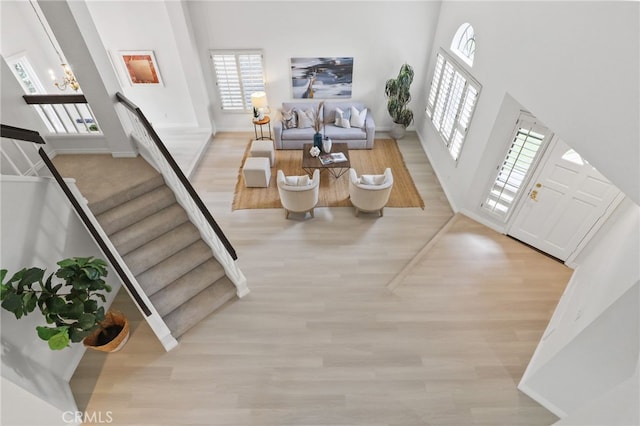 foyer featuring light hardwood / wood-style floors and a high ceiling