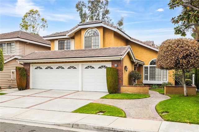 view of front of home featuring concrete driveway, brick siding, a tile roof, and stucco siding