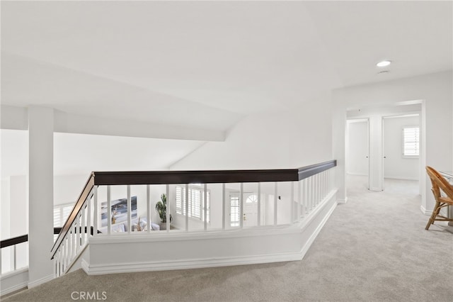 hall with vaulted ceiling, carpet floors, recessed lighting, and baseboards