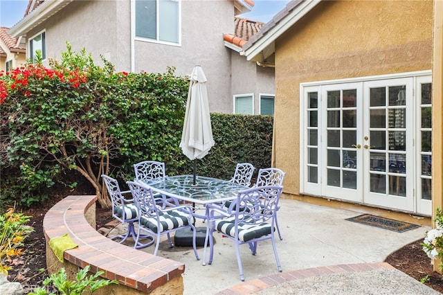 view of patio with outdoor dining space and french doors