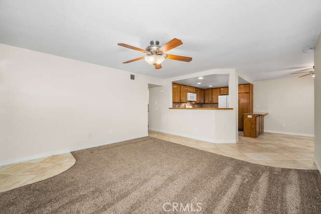 unfurnished living room with light tile patterned flooring