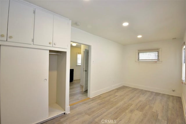 interior space featuring light hardwood / wood-style flooring and a closet