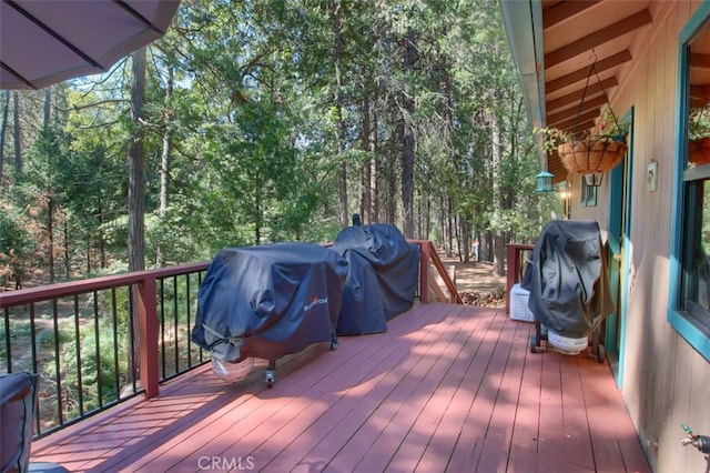 wooden terrace featuring grilling area