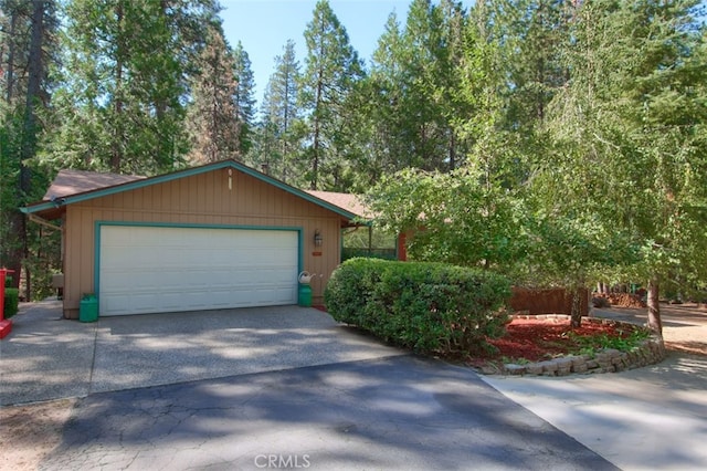 view of front of house featuring a garage and an outdoor structure