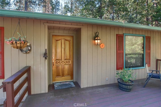 doorway to property with a deck