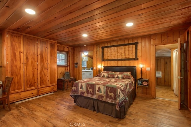 bedroom featuring hardwood / wood-style flooring, wooden ceiling, and wood walls