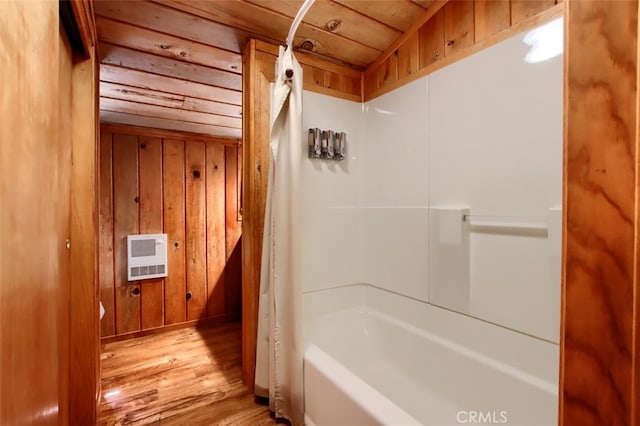 36555 Mudge Ranch Rd, Coarsegold, CA 93614 - bathroom featuring heating unit, wood finished floors, tub / shower combination, and wood walls