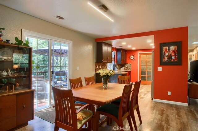 36555 Mudge Ranch Rd, Coarsegold, CA 93614 - dining space with light wood-style floors and baseboards