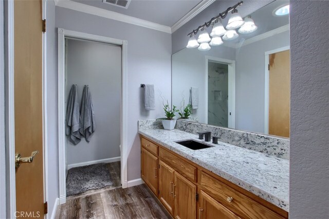 36555 Mudge Ranch Rd, Coarsegold, CA 93614 - bathroom with wood finished floors, vanity, and ornamental molding