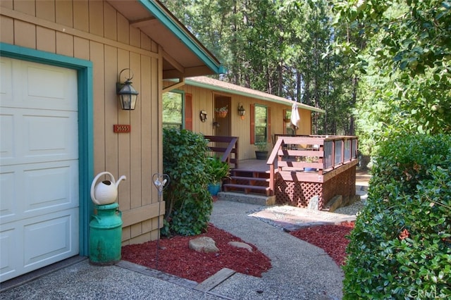 36555 Mudge Ranch Rd, Coarsegold, CA 93614 - view of exterior entry featuring a deck and a garage