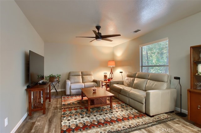 36555 Mudge Ranch Rd, Coarsegold, CA 93614 - living area with wood finished floors and ceiling fan