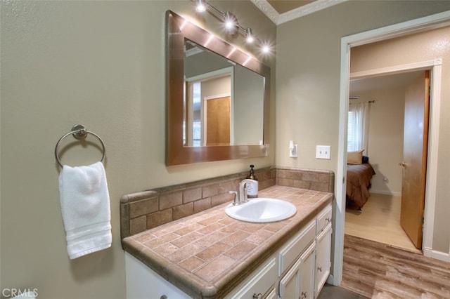 36555 Mudge Ranch Rd, Coarsegold, CA 93614 - ensuite bathroom featuring vanity, wood finished floors, and decorative backsplash