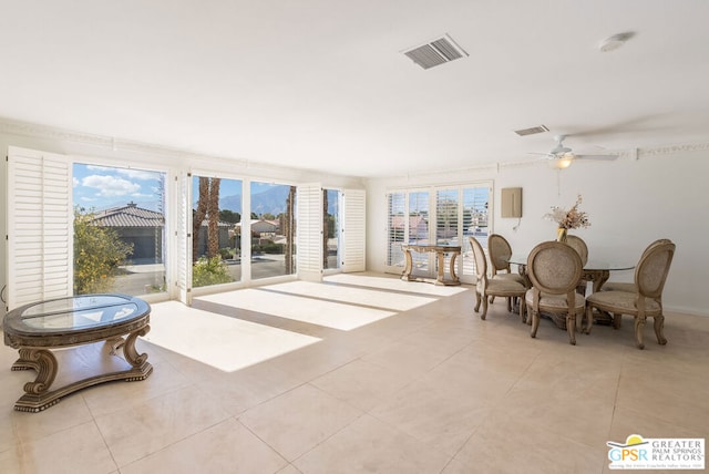 interior space featuring ceiling fan and light tile patterned flooring