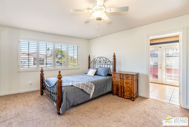 carpeted bedroom featuring ceiling fan, french doors, access to outside, and multiple windows