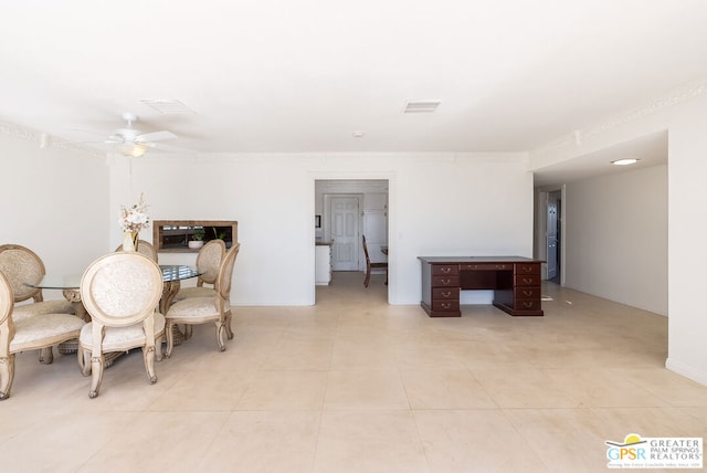 tiled dining area with ceiling fan