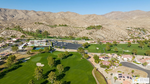 birds eye view of property featuring a mountain view