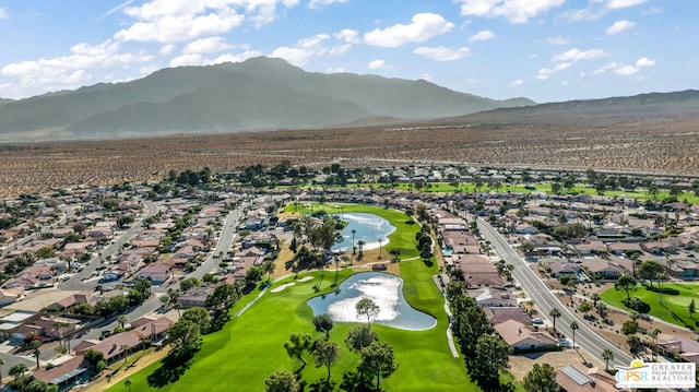 drone / aerial view featuring a water and mountain view