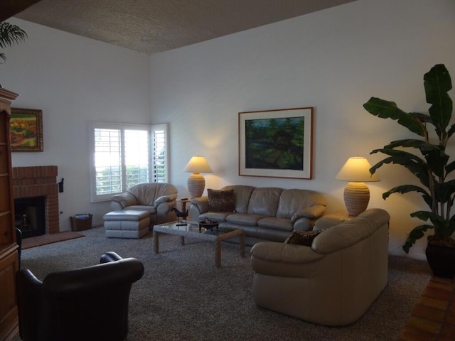 living room with carpet and a fireplace