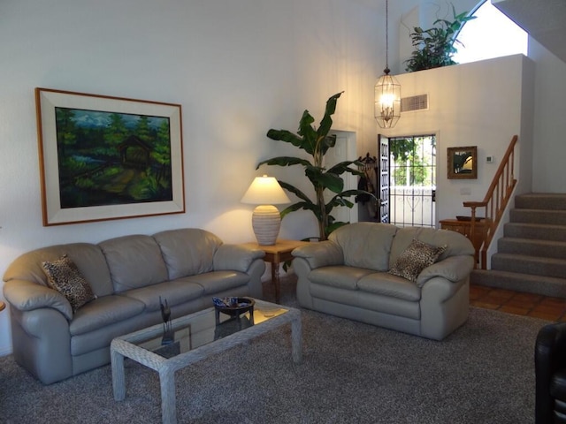 living room with a towering ceiling