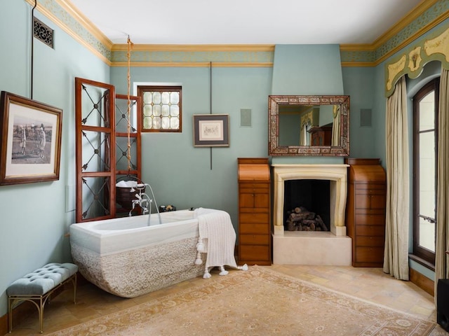 bedroom with crown molding and a high end fireplace