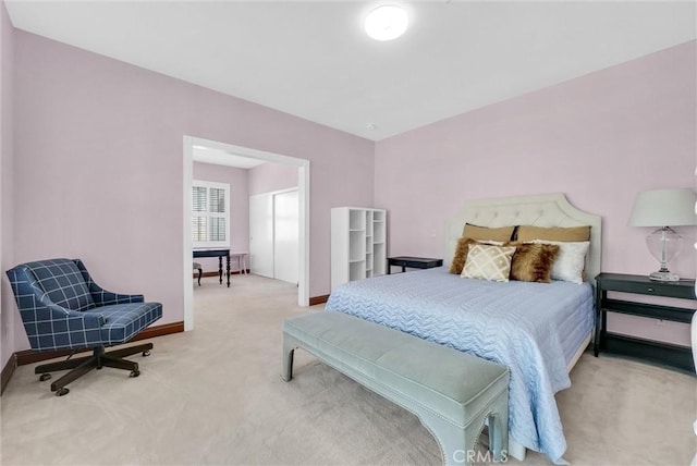 bedroom featuring light carpet