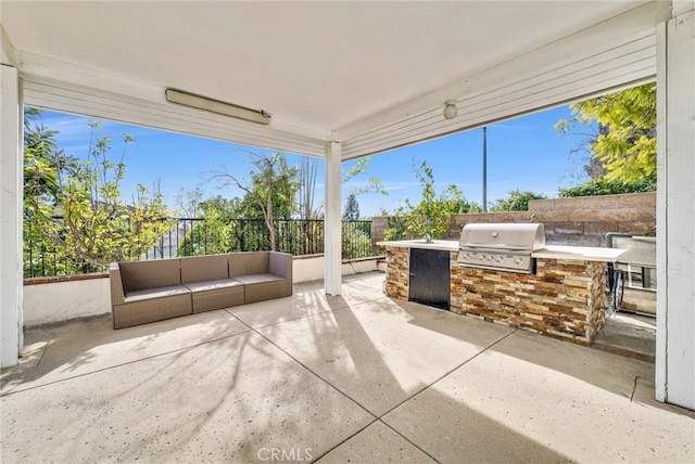 view of patio with a grill and exterior kitchen