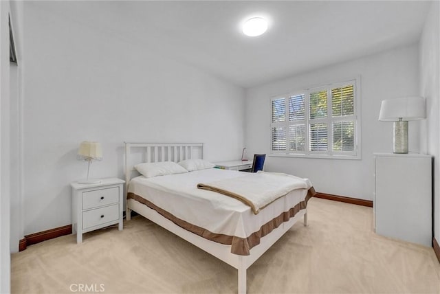 bedroom featuring light colored carpet