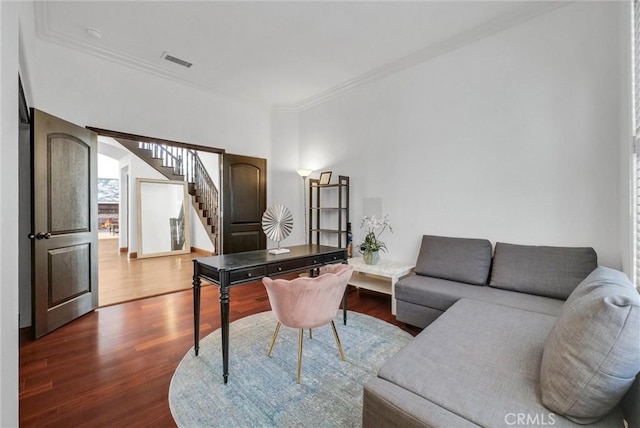 office space with wood-type flooring and crown molding