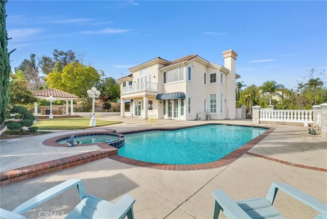 view of pool with a gazebo, a patio area, and an in ground hot tub