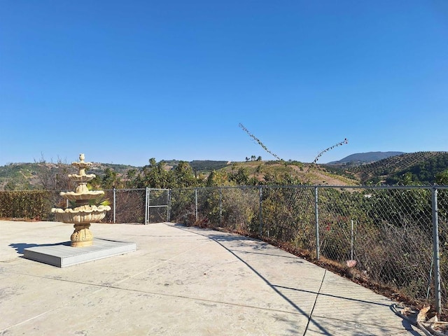 view of patio / terrace with a mountain view