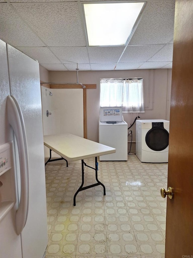 laundry room with washing machine and clothes dryer