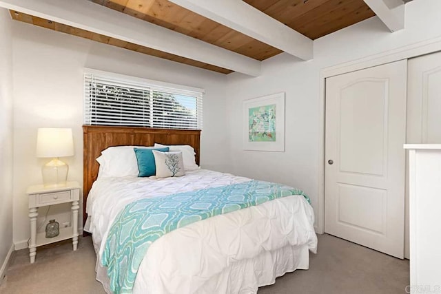 carpeted bedroom featuring wooden ceiling and beam ceiling