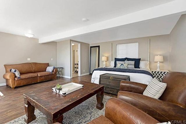 bedroom with beam ceiling and wood-type flooring