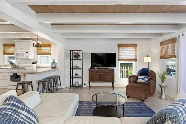 tiled living room with an inviting chandelier, wood ceiling, and beamed ceiling