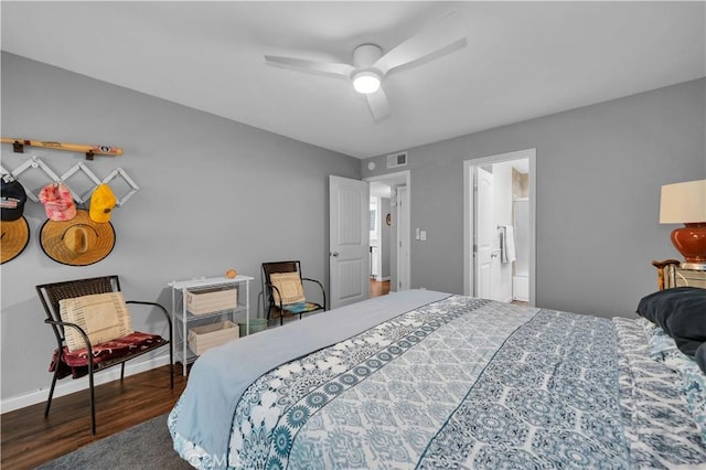 bedroom featuring ensuite bath, ceiling fan, and dark wood-type flooring