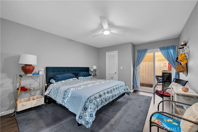 bedroom featuring access to exterior, a closet, ceiling fan, and dark wood-type flooring