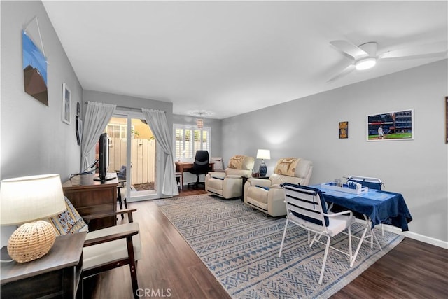 living room featuring ceiling fan and wood-type flooring