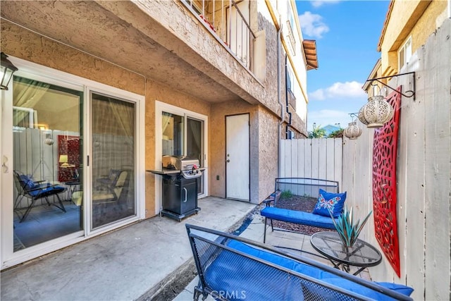 view of patio with a grill