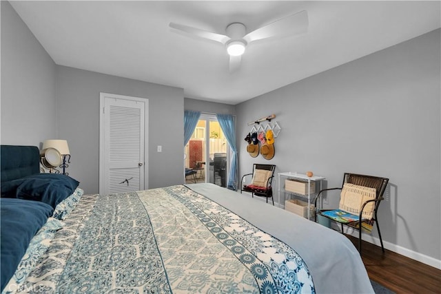 bedroom with a closet, ceiling fan, and dark hardwood / wood-style floors