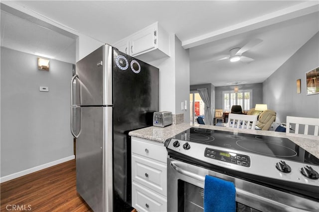 kitchen with white cabinets, ceiling fan, dark hardwood / wood-style flooring, and appliances with stainless steel finishes