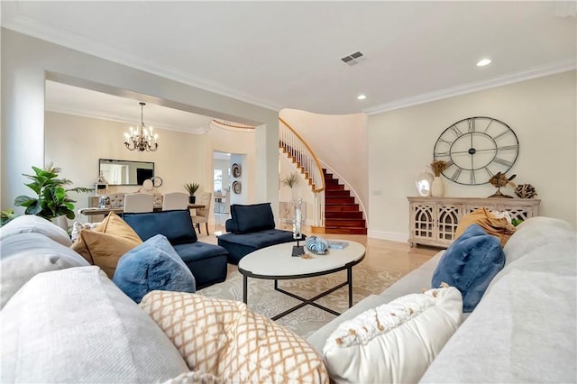 living room featuring crown molding and a notable chandelier