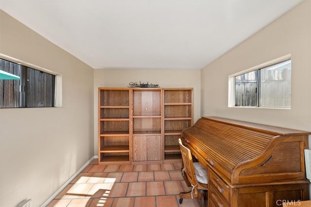 unfurnished office with tile patterned flooring